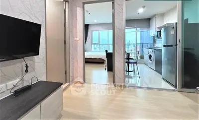 Modern apartment interior with open layout, featuring a living area, kitchen, and bedroom with city view.