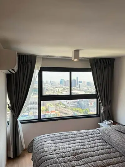 Stunning bedroom with panoramic city view and modern decor