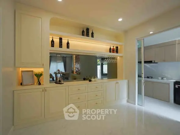 Elegant kitchen with open layout and modern cabinetry, perfect for culinary enthusiasts.