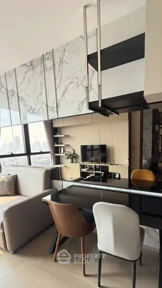 Modern living room with stylish furniture and city view, featuring marble accents and sleek design.