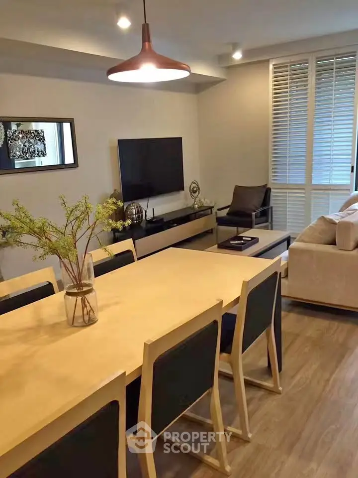 Modern living room with stylish decor and spacious dining area