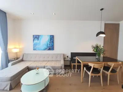 Modern living room with stylish furniture and elegant decor in a bright apartment.