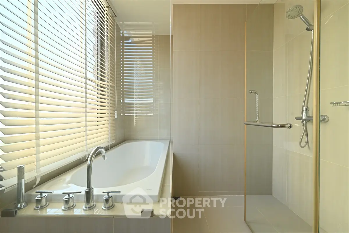 Luxurious bathroom with modern bathtub and sleek shower design