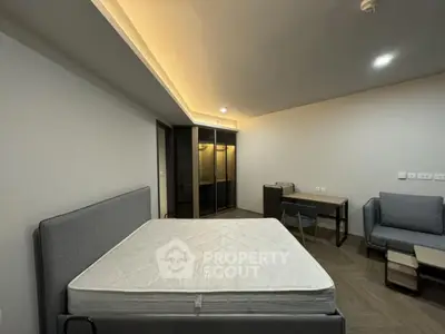 Modern bedroom with stylish furniture and ambient lighting