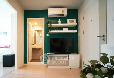 Modern living room with TV, air conditioning, and stylish decor