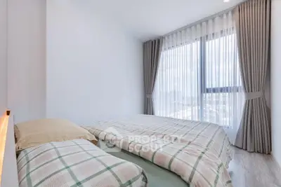 Bright and cozy bedroom with large window and elegant curtains