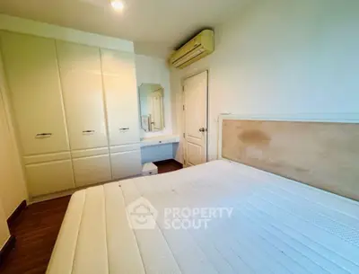 Spacious bedroom with built-in wardrobe and air conditioning