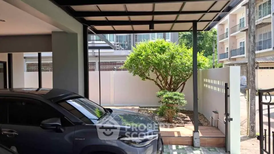 Modern carport with sleek design and lush greenery in urban setting