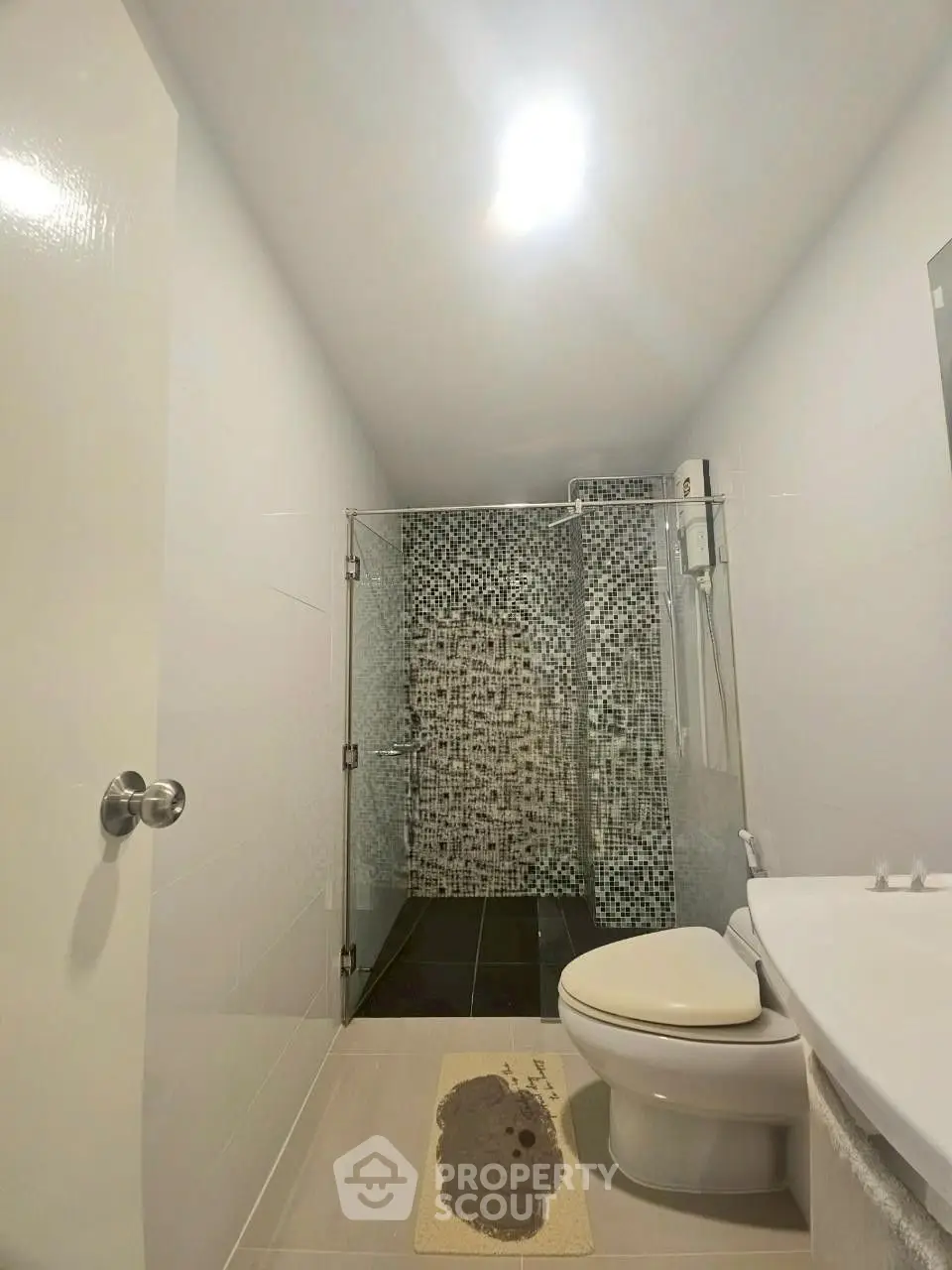 Modern bathroom with glass shower and sleek tile design