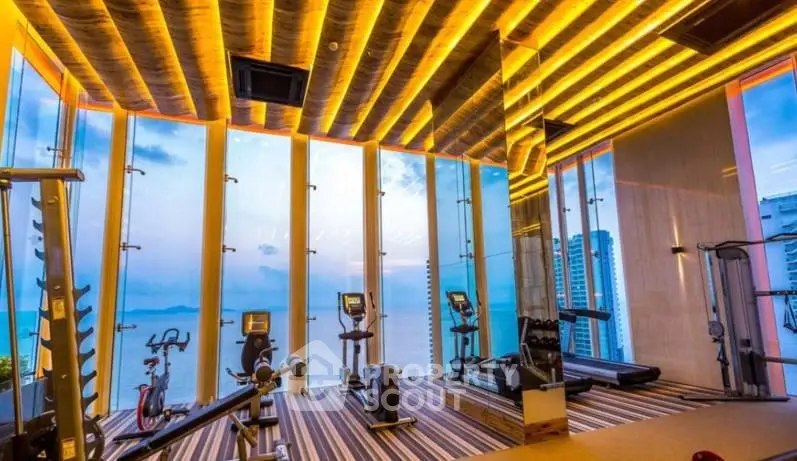 Luxurious gym with panoramic ocean view and modern equipment