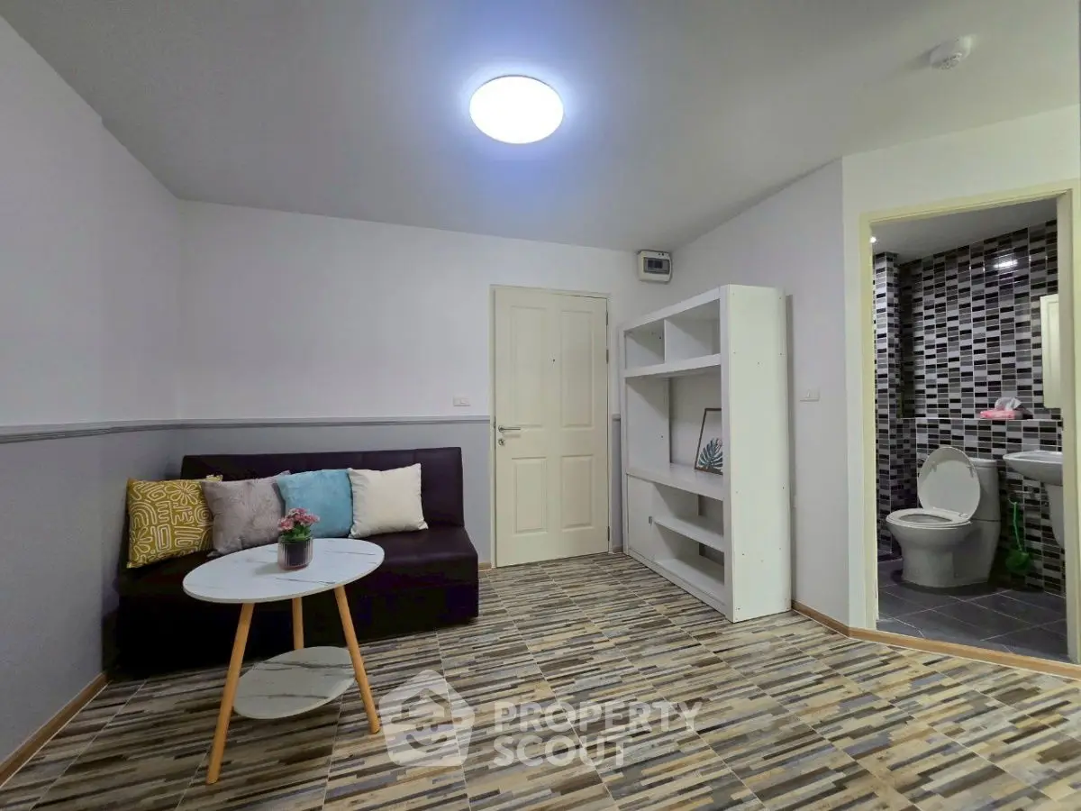 Modern living room with stylish flooring and cozy seating area