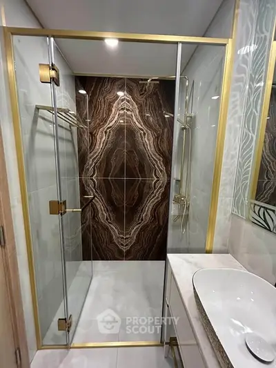 Luxurious bathroom with elegant glass shower and modern fixtures