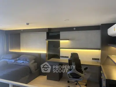 Modern bedroom with sleek study area and ambient lighting