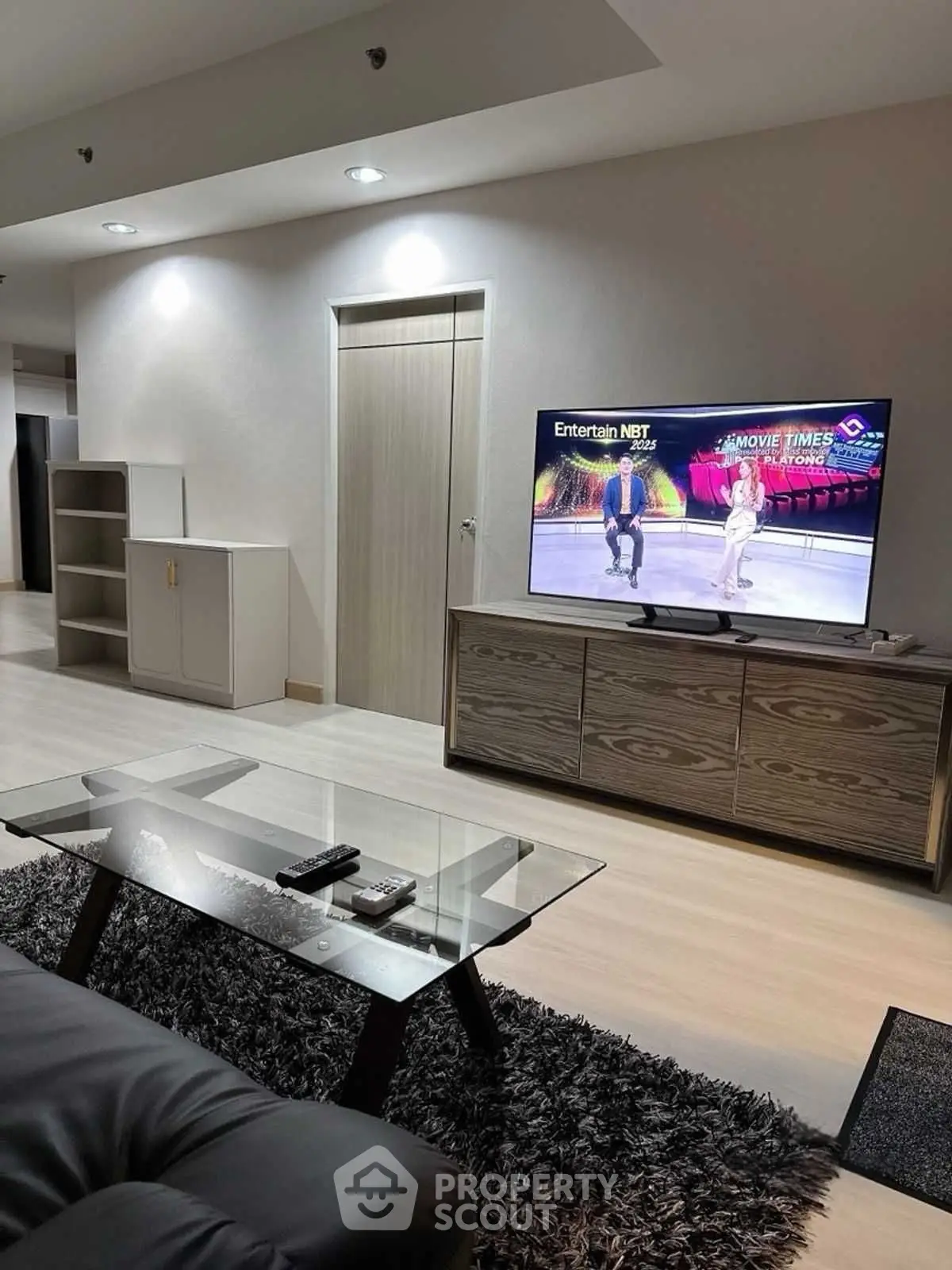Modern living room with sleek furniture and entertainment setup