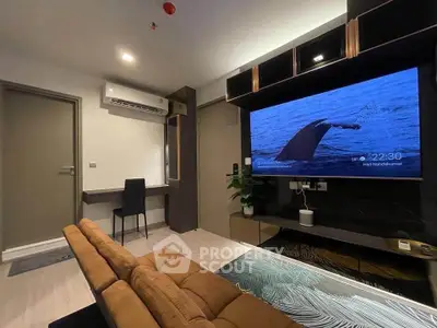 Modern living room with sleek design, featuring a large wall-mounted TV and stylish furniture.
