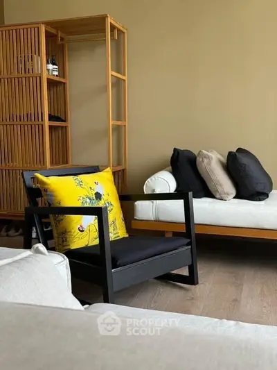 Stylish modern living room with elegant furniture and vibrant decor accents.
