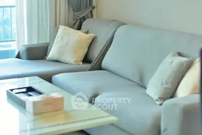 Modern living room with stylish gray sofa and elegant decor