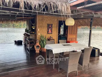 Charming riverside patio with rustic decor and serene water views