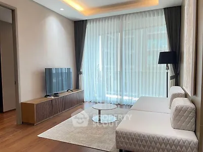 Modern living room with elegant decor, large windows, and stylish furniture in a luxury apartment.