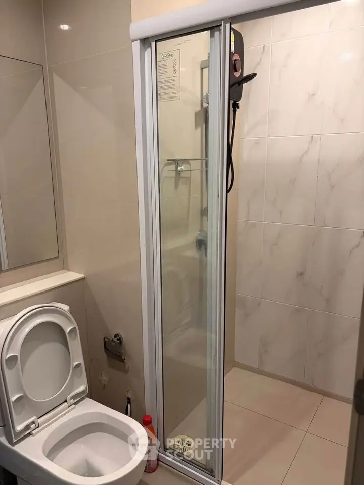Modern bathroom with shower and toilet in sleek design