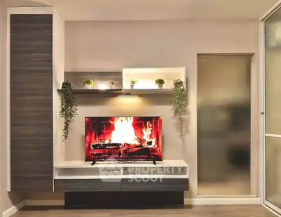 Modern living room with stylish TV unit and decorative plants