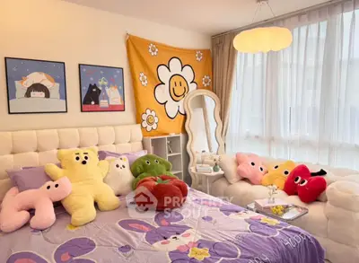 Charming bedroom with plush decor and large windows for natural light.