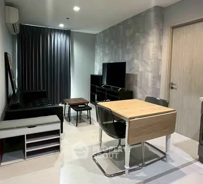 Modern living room with sleek furniture and stylish decor in a contemporary apartment.