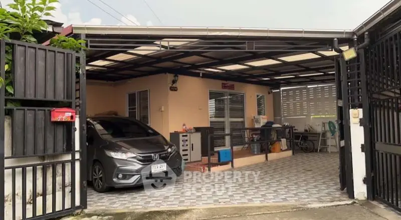 Spacious covered parking area with modern car and storage space