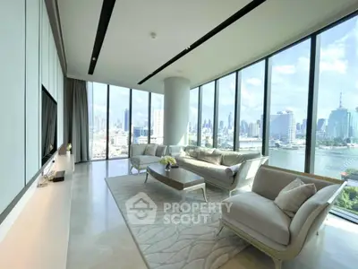 Luxurious living room with panoramic city views and elegant modern furnishings.