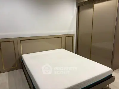 Modern bedroom with sleek design and built-in wardrobe, perfect for urban living.