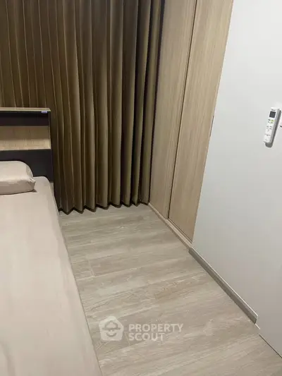 Modern bedroom with wooden flooring and sleek design