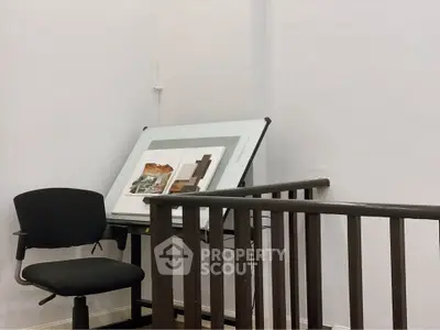 Modern study area with drafting table and chair in stylish home office