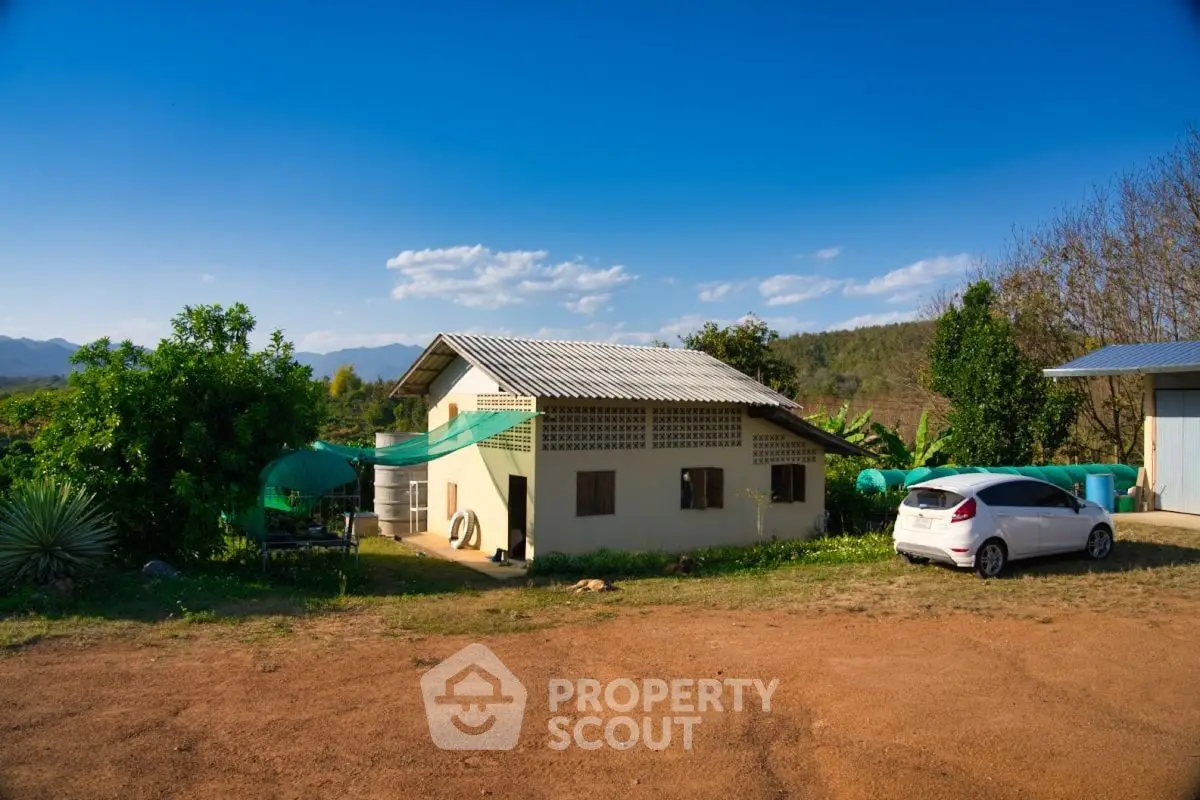 Charming rural property with spacious yard and scenic mountain views, perfect for serene living.