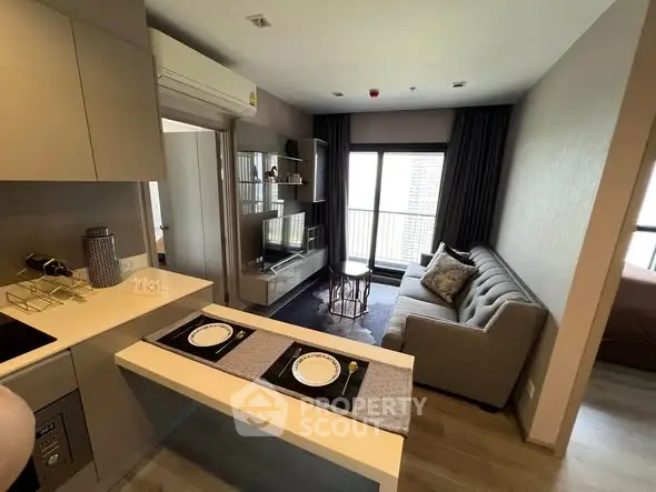 Modern living room with open kitchen and stylish decor in a cozy apartment