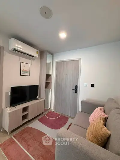 Cozy modern living room with stylish decor and air conditioning