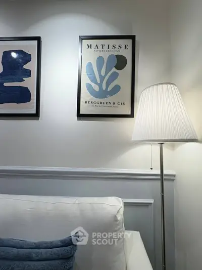 Cozy living room with elegant wall art and modern floor lamp