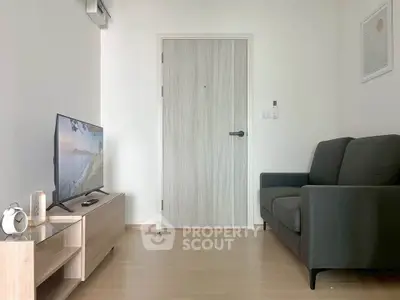 Modern living room with sleek furniture and minimalist decor, perfect for cozy relaxation.