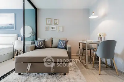 Modern living room with stylish decor and cozy dining area in a contemporary apartment.