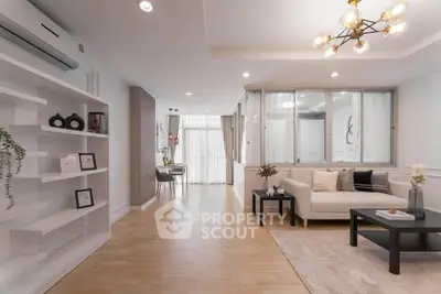 Spacious modern living room with elegant decor and natural light.