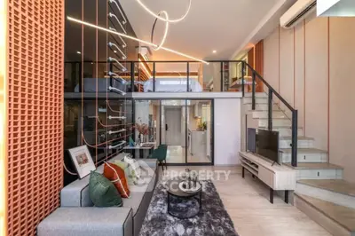 Modern duplex living room with stylish decor and mezzanine bedroom