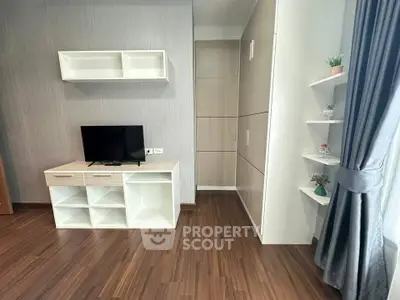 Modern living room with sleek TV stand and stylish shelving