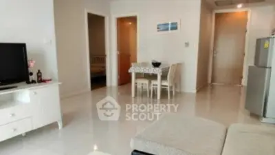 Modern living room with sleek furniture and open layout in a stylish apartment.