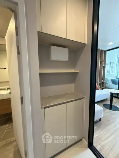 Modern apartment interior with sleek storage and cozy living area, perfect for urban living.