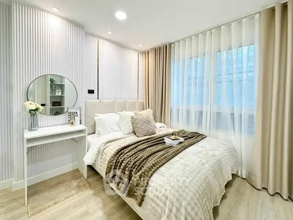 Elegant bedroom with cozy decor and natural light