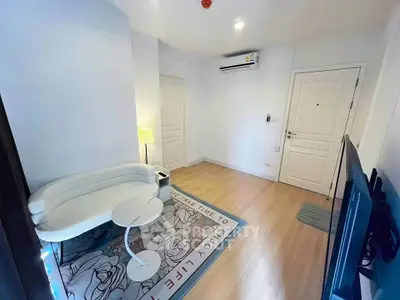Modern living room with stylish furniture and air conditioning in a cozy apartment.