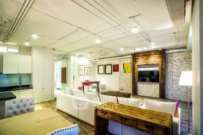 Stylish modern living room with exposed brick and chic furnishings