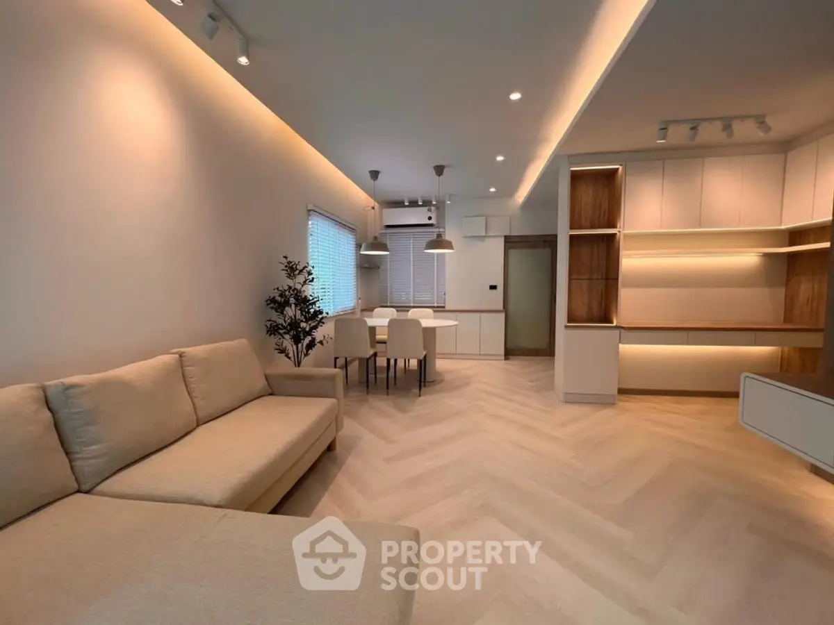 Spacious modern living room with elegant lighting and open layout