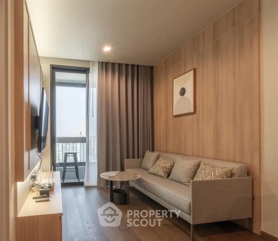 Modern living room with stylish decor and balcony view