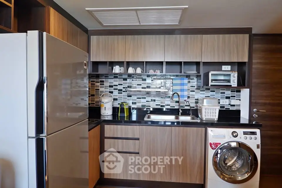 Modern kitchen with sleek appliances and stylish cabinetry