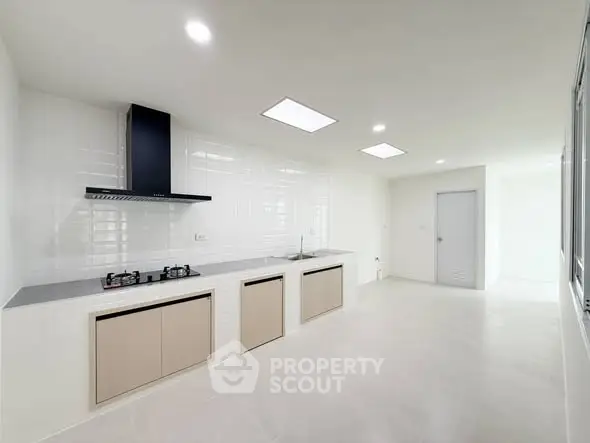 Sleek modern kitchen with gas stove and minimalist design